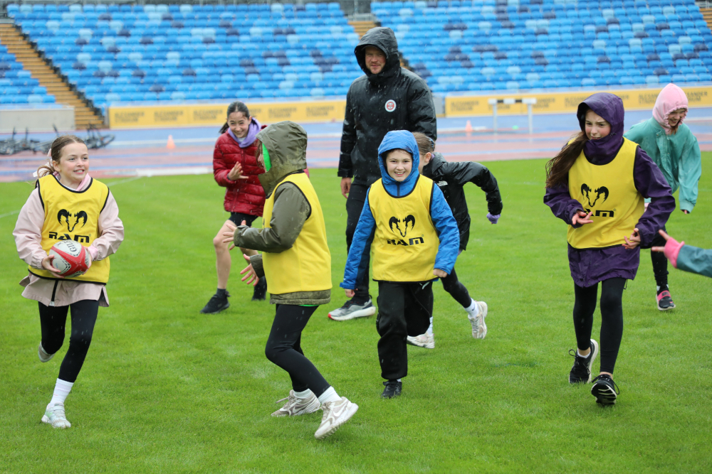 Girls playing rugby